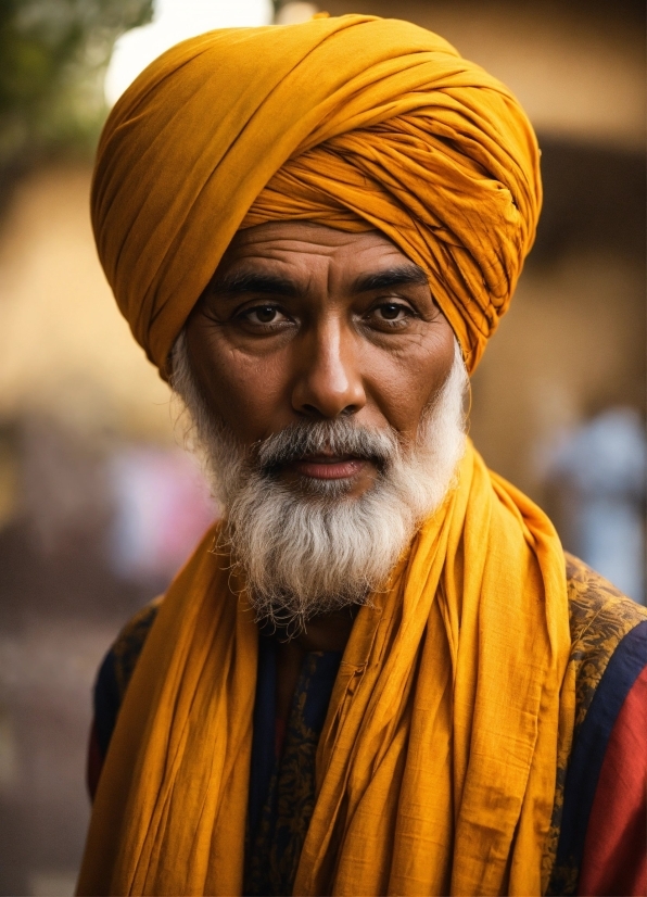 Clothing, Forehead, Face, Eye, Orange, Turban